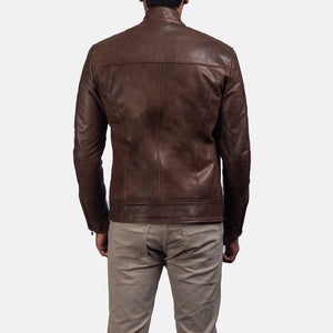 Back view of a stylish chocolate brown leather jacket on a man paired with casual beige pants.